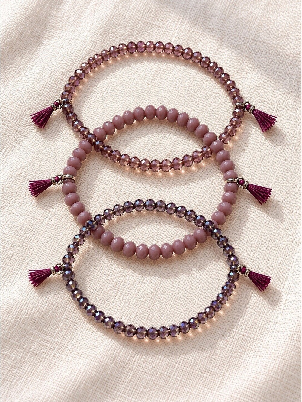 Set of 3 Purple Beaded Stretch Bracelets with Mini Tassels